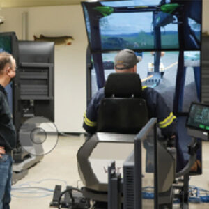 An image of a person operating a heavy equipment simulator.